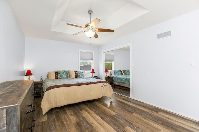 34701 E 235th St, Pleasant Hill, MO 64080 - bedroom featuring dark wood-style flooring, a ceiling fan, visible vents, and baseboards