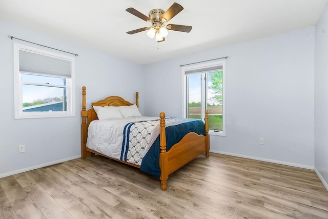 34701 E 235th St, Pleasant Hill, MO 64080 - bedroom with baseboards, light wood finished floors, and ceiling fan