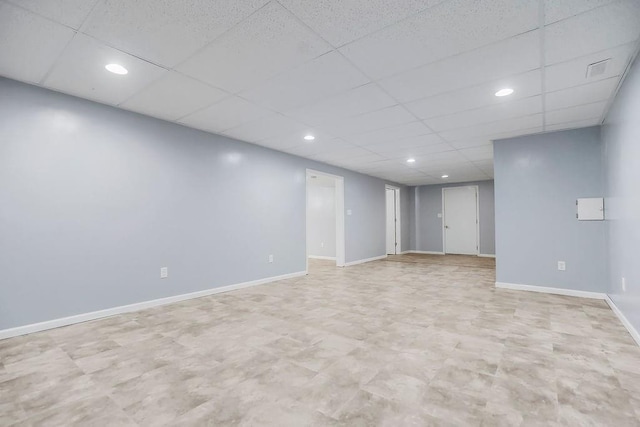 34701 E 235th St, Pleasant Hill, MO 64080 - finished basement with recessed lighting, baseboards, a paneled ceiling, and light floors