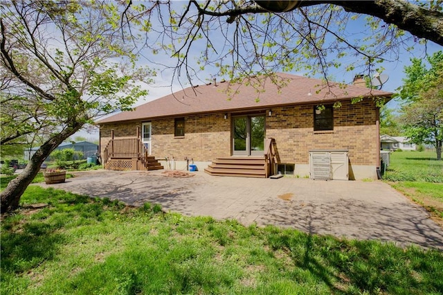 34701 E 235th St, Pleasant Hill, MO 64080 - rear view of property featuring brick siding, a lawn, a chimney, and a patio