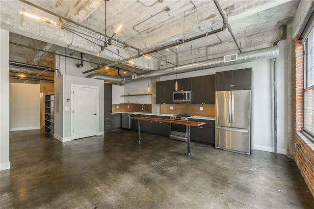 715 May St Unit 328, Kansas City, MO 64105 - garage with freestanding refrigerator and baseboards