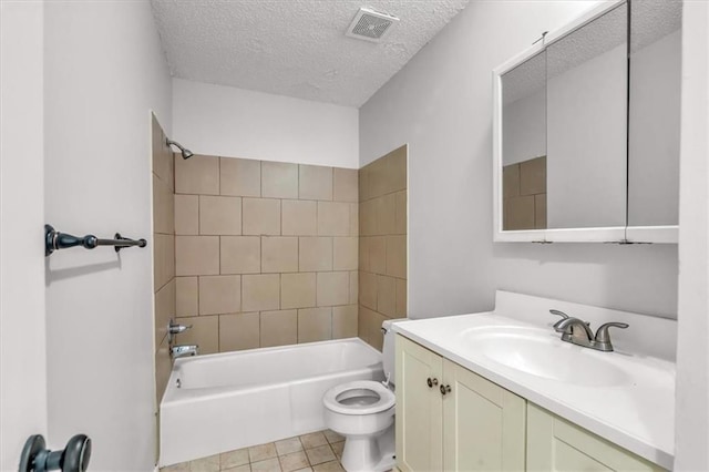 full bath featuring visible vents, toilet, vanity, tub / shower combination, and a textured ceiling
