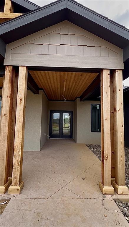 20840 Golden Rd, Linwood, KS 66052 - entrance to property featuring french doors, stucco siding, and a patio