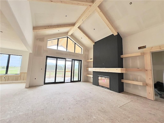 20840 Golden Rd, Linwood, KS 66052 - unfurnished living room featuring high vaulted ceiling, a glass covered fireplace, plenty of natural light, and beamed ceiling