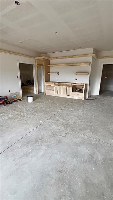 20840 Golden Rd, Linwood, KS 66052 - unfurnished living room with concrete flooring