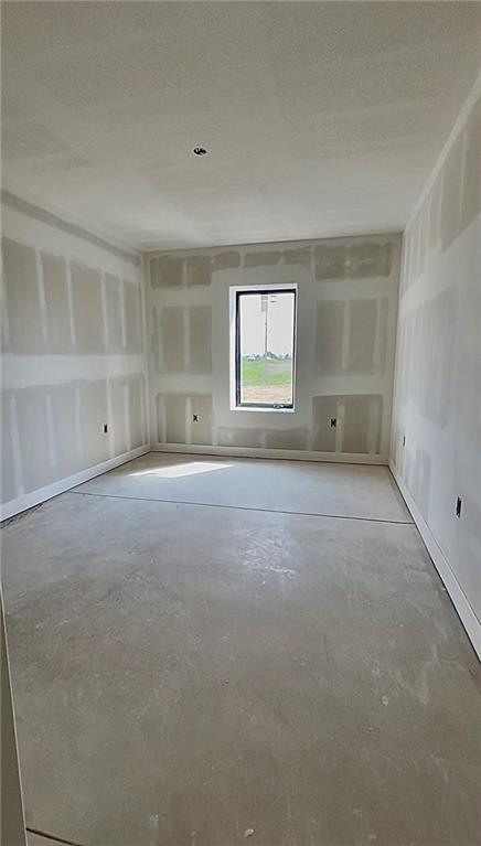 20840 Golden Rd, Linwood, KS 66052 - empty room with unfinished concrete floors