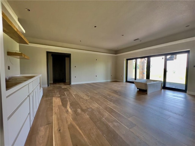 20840 Golden Rd, Linwood, KS 66052 - unfurnished living room with hardwood / wood-style floors and baseboards