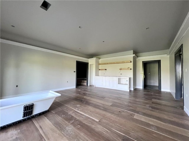 20840 Golden Rd, Linwood, KS 66052 - unfurnished living room featuring wood finished floors and ornamental molding