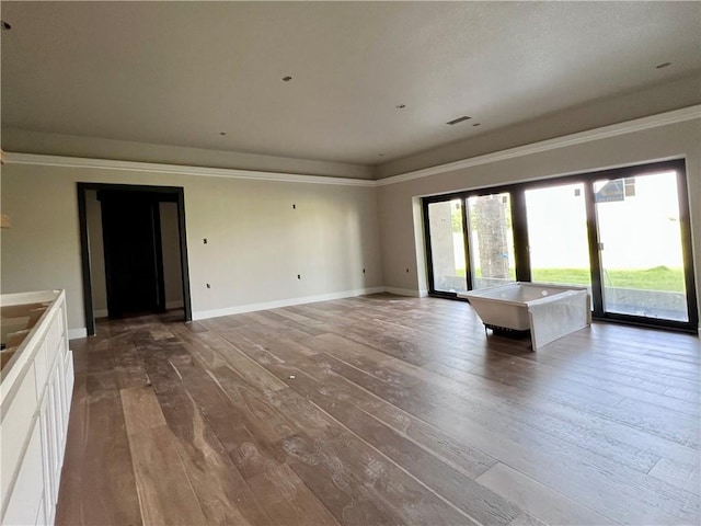 20840 Golden Rd, Linwood, KS 66052 - unfurnished living room with hardwood / wood-style flooring and baseboards