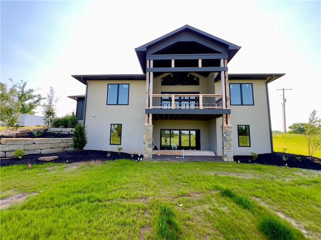 20840 Golden Rd, Linwood, KS 66052 - rear view of house with stucco siding, a balcony, and a yard