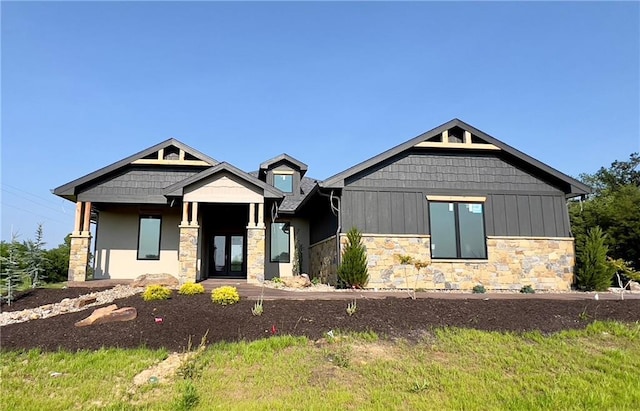 20840 Golden Rd, Linwood, KS 66052 - craftsman-style home with stone siding, board and batten siding, and french doors
