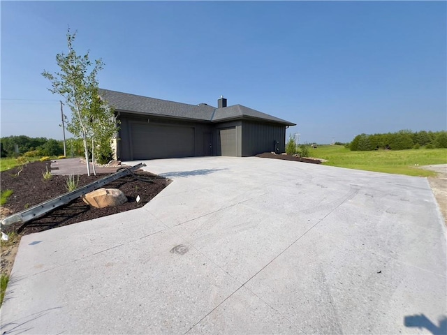 20840 Golden Rd, Linwood, KS 66052 - view of front of property with an attached garage and concrete driveway
