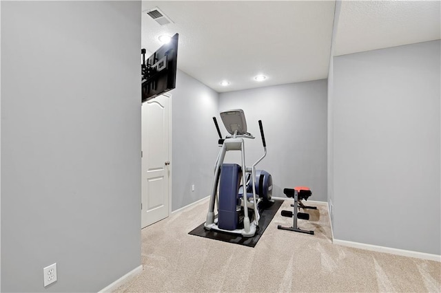 workout room featuring baseboards, carpet, and visible vents