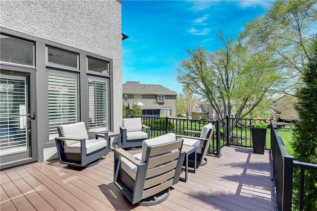 wooden terrace featuring an outdoor living space