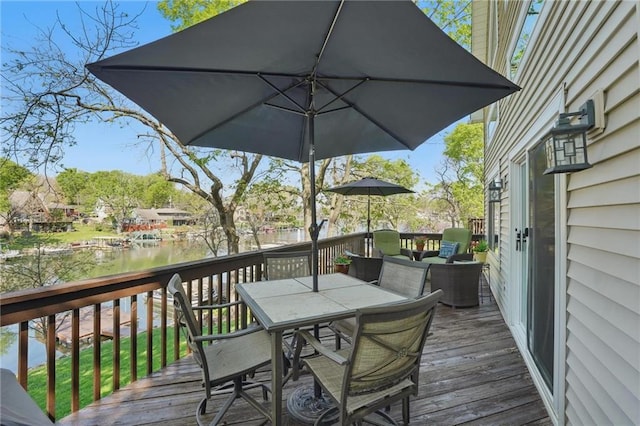 62 Beach Dr, Lake Tapawingo, MO 64015 - wooden deck with outdoor dining area and a water view