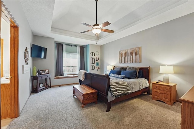 62 Beach Dr, Lake Tapawingo, MO 64015 - bedroom featuring light colored carpet, a tray ceiling, ceiling fan, and baseboards
