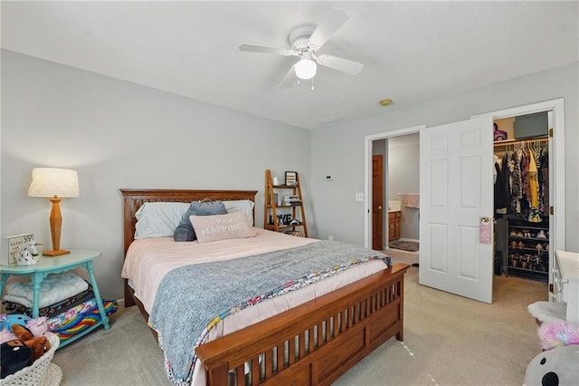 62 Beach Dr, Lake Tapawingo, MO 64015 - bedroom with light colored carpet, a walk in closet, a closet, and a ceiling fan