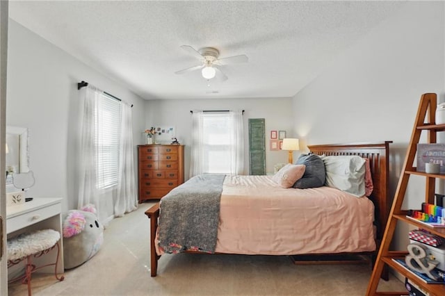 62 Beach Dr, Lake Tapawingo, MO 64015 - carpeted bedroom featuring a textured ceiling and ceiling fan