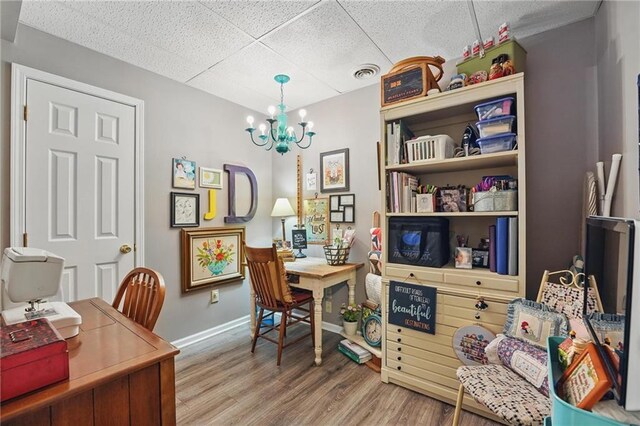 62 Beach Dr, Lake Tapawingo, MO 64015 - office with a chandelier, wood finished floors, baseboards, and a paneled ceiling