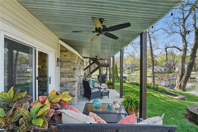 62 Beach Dr, Lake Tapawingo, MO 64015 - view of patio with a ceiling fan, a water view, an outdoor hangout area, and stairs