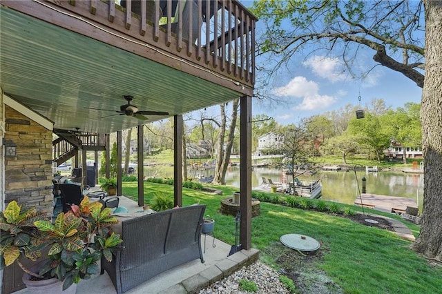 62 Beach Dr, Lake Tapawingo, MO 64015 - view of patio / terrace with ceiling fan, a water view, and an outdoor hangout area