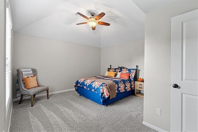 bedroom featuring baseboards, carpet, and vaulted ceiling