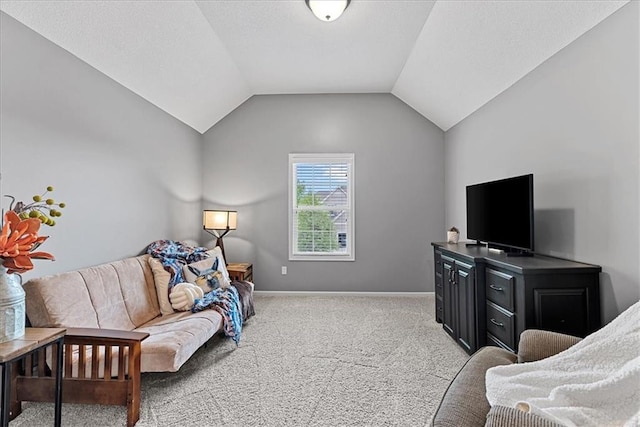 carpeted bedroom featuring baseboards and vaulted ceiling