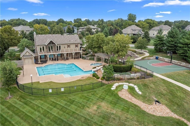 pool featuring fence, a yard, and a wooden deck