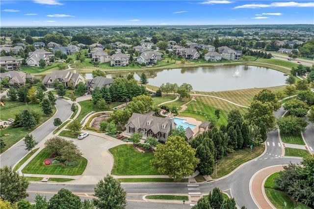drone / aerial view with a residential view and a water view