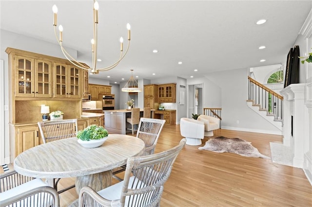 14215 W 157th Ter, Olathe, KS 66062 - dining space with recessed lighting, stairway, light wood-type flooring, and baseboards