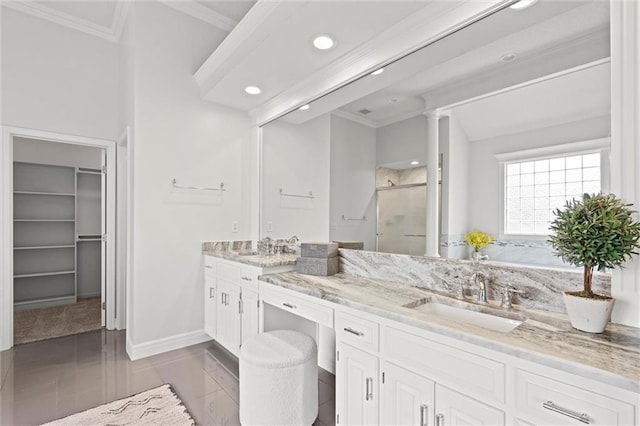 14215 W 157th Ter, Olathe, KS 66062 - bathroom with ornamental molding, a stall shower, double vanity, recessed lighting, and a walk in closet