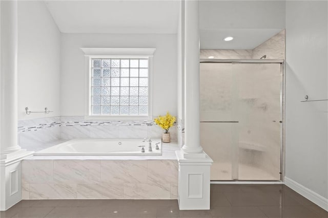 14215 W 157th Ter, Olathe, KS 66062 - bathroom with a bath, a shower stall, tile patterned flooring, and ornate columns