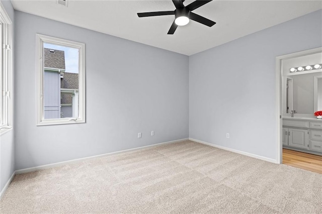 14215 W 157th Ter, Olathe, KS 66062 - unfurnished bedroom with carpet, ensuite bathroom, baseboards, and a sink