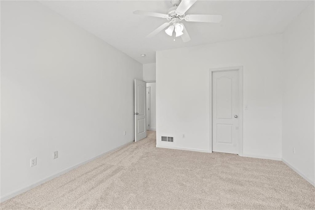 14215 W 157th Ter, Olathe, KS 66062 - spare room featuring light carpet, a ceiling fan, and baseboards