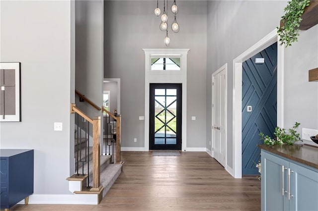17894 169th St, Basehor, KS 66007 - entryway featuring a high ceiling, stairs, and wood finished floors
