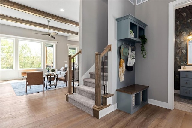17894 169th St, Basehor, KS 66007 - stairs featuring wood finished floors, ceiling fan, beamed ceiling, and recessed lighting