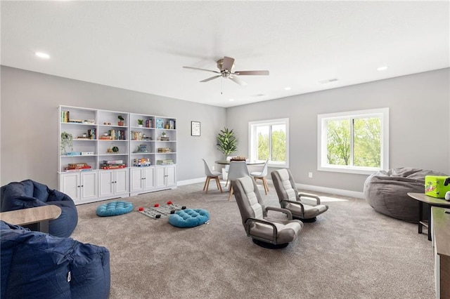 17894 169th St, Basehor, KS 66007 - carpeted living area featuring a ceiling fan and recessed lighting