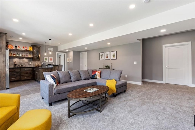 17894 169th St, Basehor, KS 66007 - living room featuring bar with sink, recessed lighting, and light carpet
