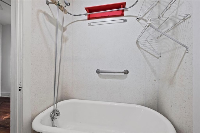 full bath featuring a freestanding tub