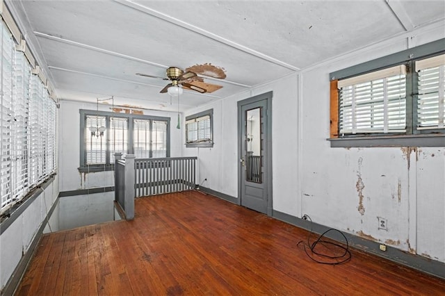 interior space with ceiling fan and hardwood / wood-style floors