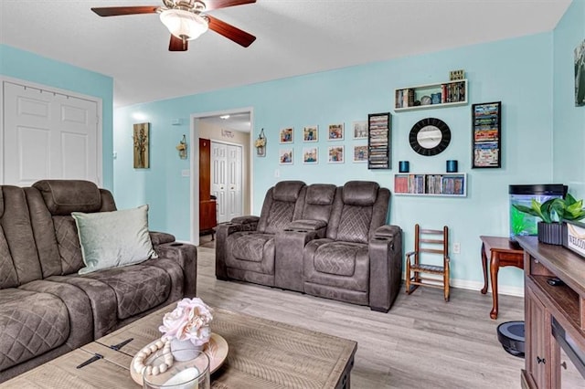 204 Lynn St, Lathrop, MO 64465 - living room featuring a ceiling fan, wood finished floors, and baseboards