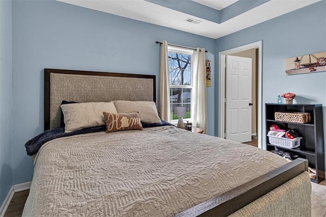 204 Lynn St, Lathrop, MO 64465 - bedroom with wood finished floors and baseboards