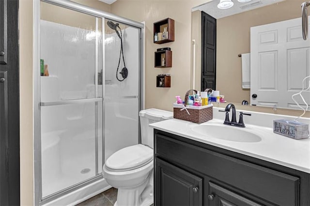 204 Lynn St, Lathrop, MO 64465 - bathroom featuring vanity, toilet, a stall shower, and tile patterned floors