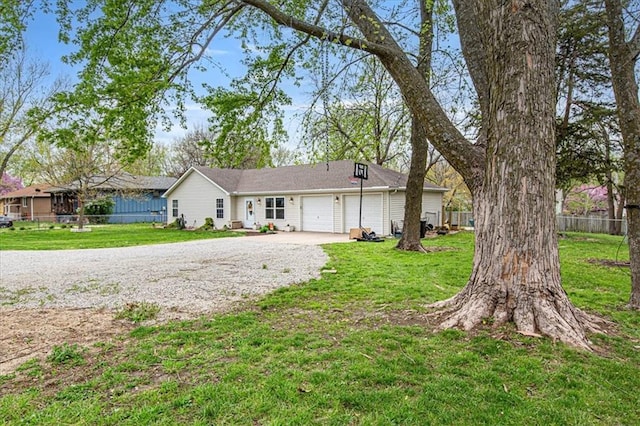204 Lynn St, Lathrop, MO 64465 - ranch-style house featuring a garage and gravel driveway