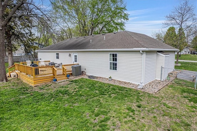204 Lynn St, Lathrop, MO 64465 - rear view of house featuring central AC, a wooden deck, and roof with shingles