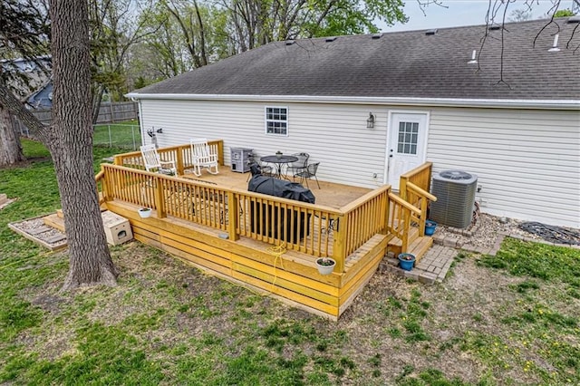 204 Lynn St, Lathrop, MO 64465 - back of house with central AC unit, a wooden deck, a shingled roof, and outdoor dining area