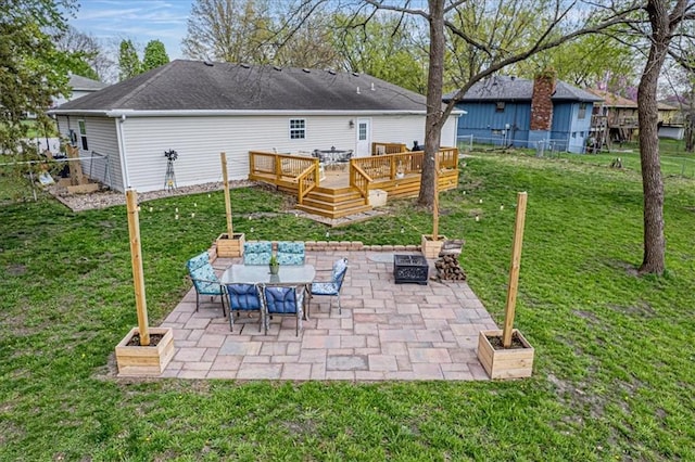 204 Lynn St, Lathrop, MO 64465 - view of patio with a deck and outdoor dining area