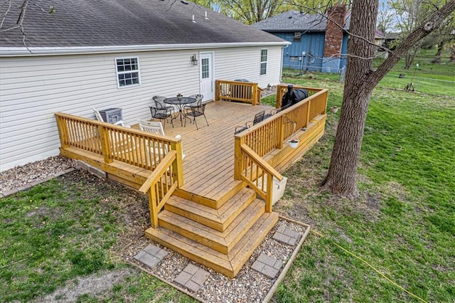 204 Lynn St, Lathrop, MO 64465 - wooden terrace featuring outdoor dining space