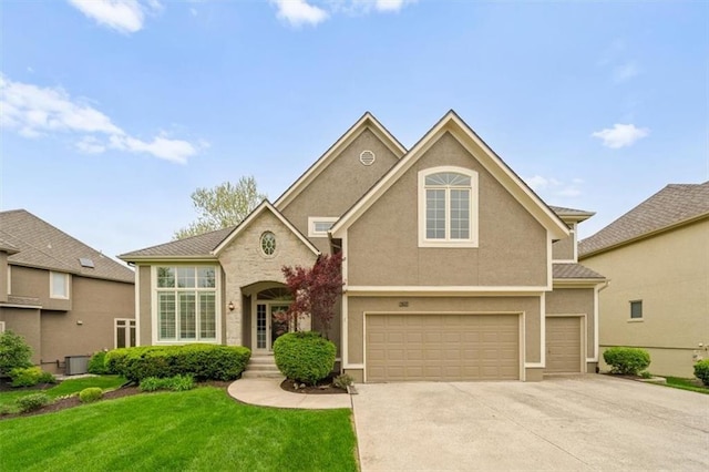 traditional-style home with an attached garage, a front lawn, stucco siding, and concrete driveway