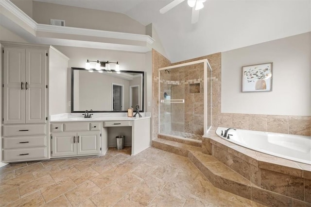 full bath with ceiling fan, vanity, lofted ceiling, a garden tub, and a stall shower